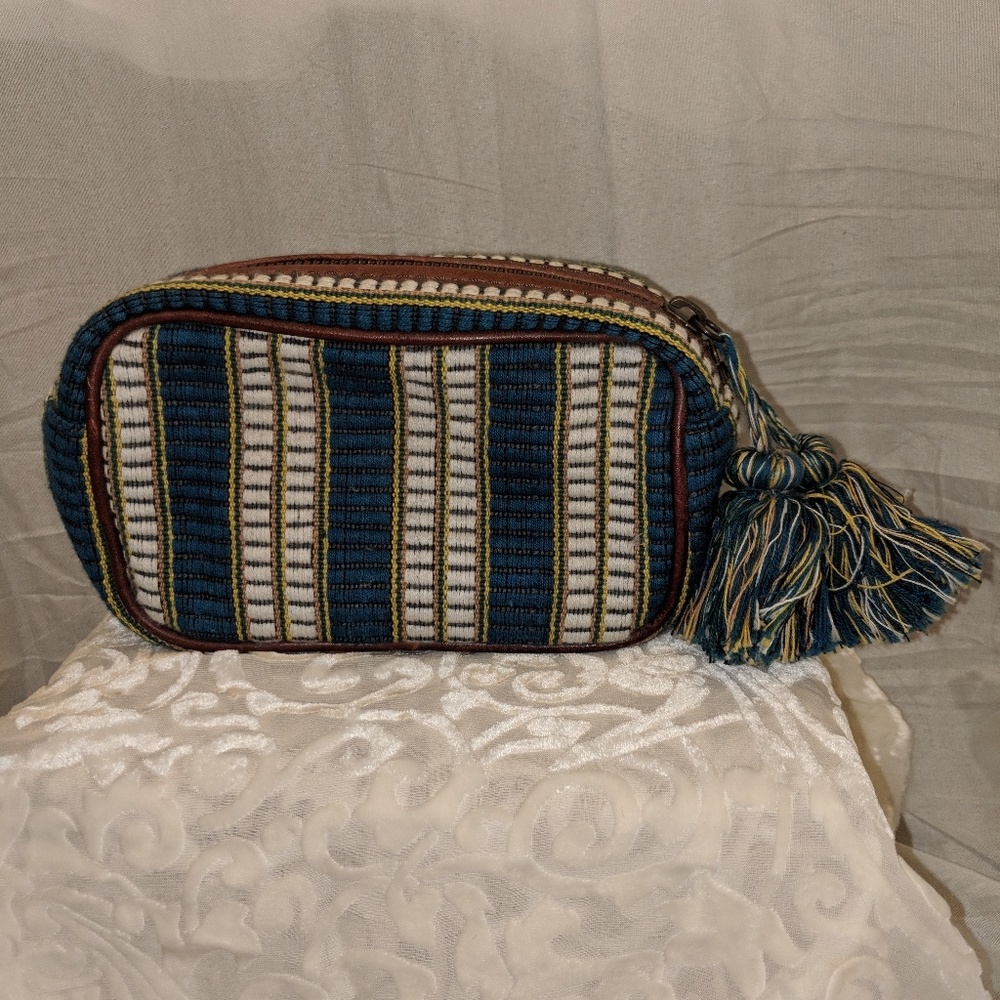 Greek, teal, yellow, white, and brown bag